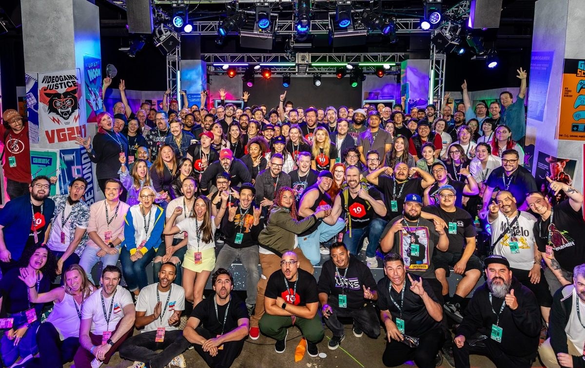 A crowd of guests posing for a group photo at Magic Box Event Campus
